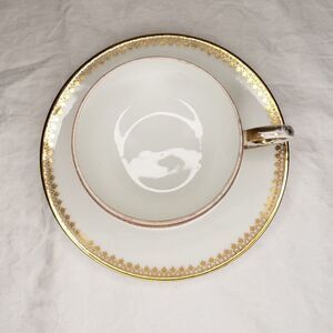 Antique Limoges gold Chintz porcelain cup saucer
